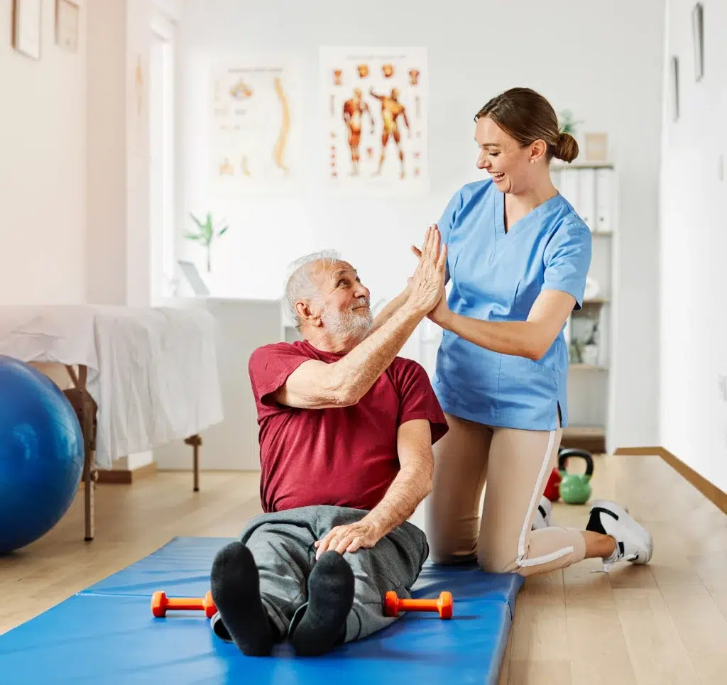 Rehabilitation therapist working with a client on recovery exercises